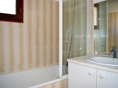 a bathroom with a sink and a shower at Appartement T2 lumineux pour 2 pers, Les Angles - FR-1-593-1 in Les Angles