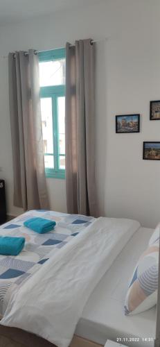 Ένα ή περισσότερα κρεβάτια σε δωμάτιο στο Apartments COMFY - for a quiet family holiday