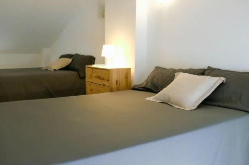 Posteľ alebo postele v izbe v ubytovaní Biznaga House, loft privado e independiente