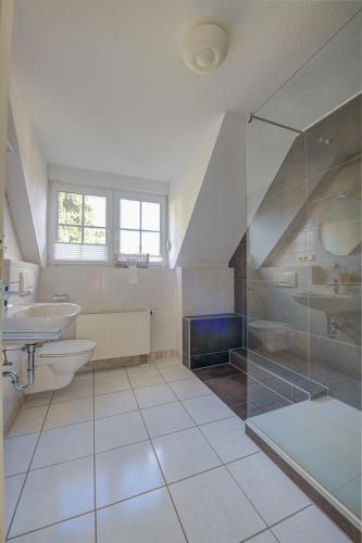 a bathroom with a sink toilet and a shower at Ferienwohnung Panorama Moselblick in Treis-Karden