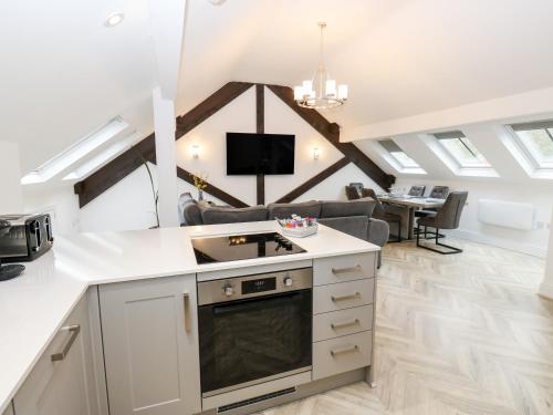 a kitchen and living room in a loft conversion at The Penthouse in York