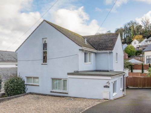 a white house with a grey roof at Welsummer in Salcombe