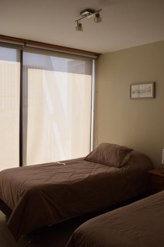 Ein Bett oder Betten in einem Zimmer der Unterkunft Terrazas de Maitencillo