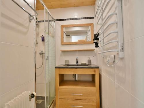 a small bathroom with a sink and a shower at Appartement Le Grand-Bornand, 2 pièces, 6 personnes - FR-1-391-119 in Le Grand-Bornand
