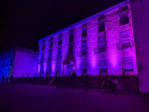 a building with purple lights on it at night at Abingdon House in Torquay