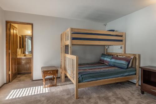 a bunk bed in a room with a mirror at 2 bedroom 3 bath in Forest Creek 35 sleeps 5 Just steps to free town shuttle Great Views in Mammoth Lakes