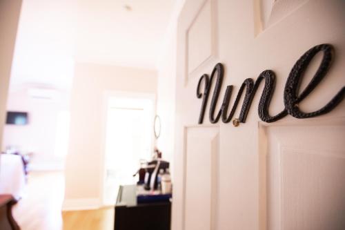 a room with a door with the word hire on it at Elaine's Cape May Boutique Hotel in Cape May