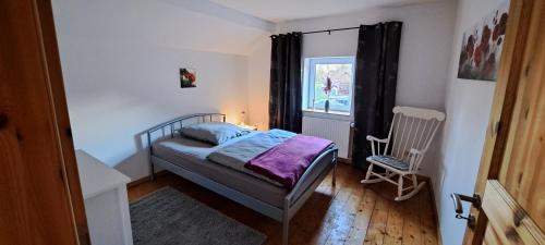 Postel nebo postele na pokoji v ubytování Gästehaus Haverbeck