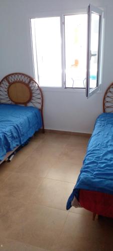 Giường trong phòng chung tại Bella vista cabonegro