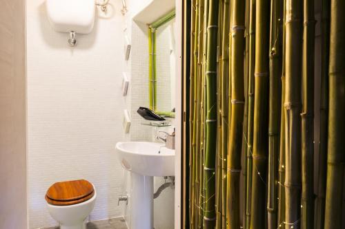 a bathroom with a sink and a toilet and a sink at Opera Suites - Il sentiero della felicità in Calcata