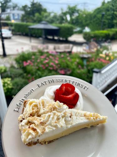 a piece of pie on a plate with a heart on it at Elaine's Cape May Boutique Hotel in Cape May