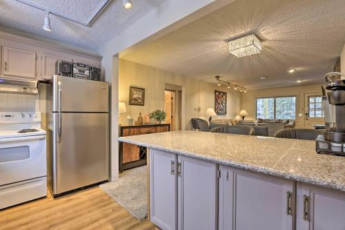 a kitchen with a refrigerator and a dining room at Condo on Fraser River Less Than 4 Mi to Winter Park Resort in Winter Park
