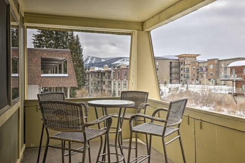 a balcony with four chairs and a table and a window at Condo on Fraser River Less Than 4 Mi to Winter Park Resort in Winter Park