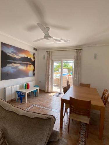 a living room with a couch and a table at Villa Arizona in Catral