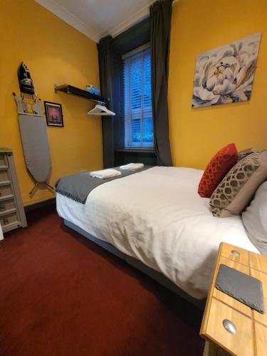 a hotel room with two beds and a window at The Residence - NO 8 in Edinburgh