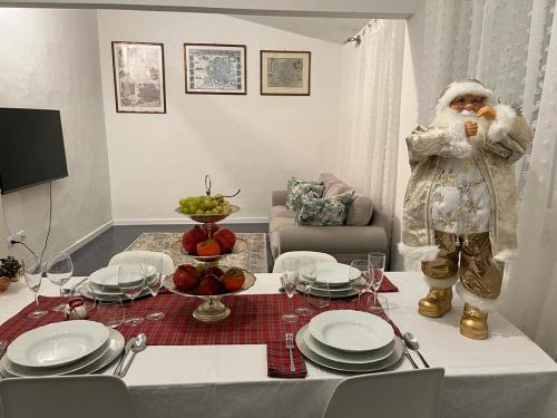 a santa claus is standing in a living room at Artemisia in Viareggio