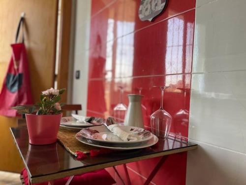 a table with plates and wine glasses on it at A 2 minutes de Casa Finance City, appartement avec 2 Chambres in Casablanca