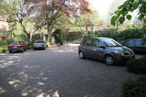 a group of cars parked in a parking lot at Hotel Astoria Gent in Ghent
