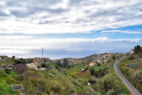 a winding road through a small town on a hill at Casa da Piedade, a Home in Madeira in Ponta do Sol