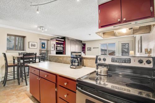a kitchen with a stove and a counter top at Silver Queen 7300 in Silverthorne