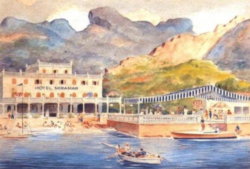 a painting of a hotel with boats in the water at Hotel Miramar Mallorca in Port de Pollensa