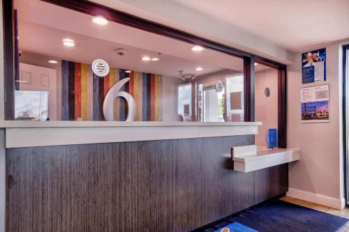 a lobby with a counter and a mirror at Motel 6-Jackson, MS in Jackson