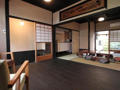 a room with a living room with a table at Brian Private Machiya in Higashiyama in Kyoto