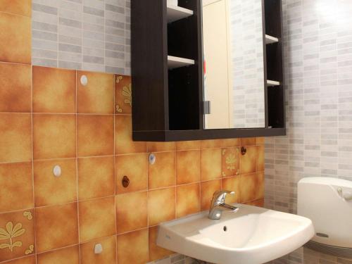 a bathroom with a sink and a mirror at Appartement Vars, 1 pièce, 4 personnes - FR-1-330B-121 in Vars