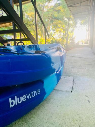 a blue wave boat sitting under a building at Terrazas del Golfo in La Palma