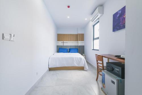 Ένα ή περισσότερα κρεβάτια σε δωμάτιο στο Residence 110 (Hotel and Apartments)