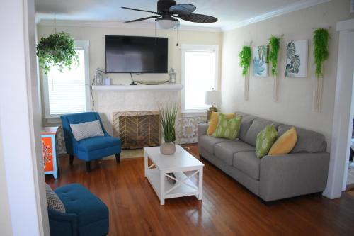 a living room with a couch and a fireplace at In the heart of West Palm Beach, pets welcome in West Palm Beach