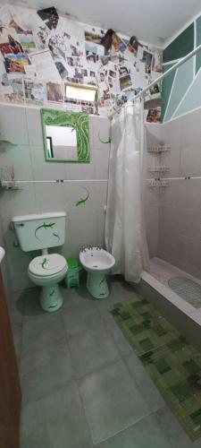 a bathroom with a toilet and a sink and a shower at La Chelca in San Fernando del Valle de Catamarca