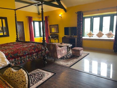 a bedroom with yellow walls and a bed and windows at Habba Kadal Kashmiri Heritage Hotel & Hub in Coonoor