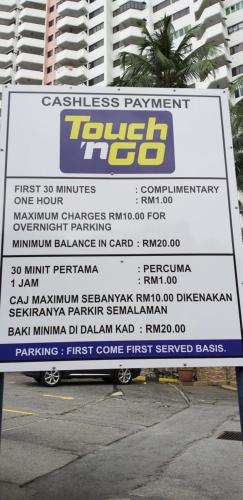 a sign for a tennis tournament in front of a building at Batu Ferringhi Luxury Seaview Suite - 3Br in Batu Ferringhi