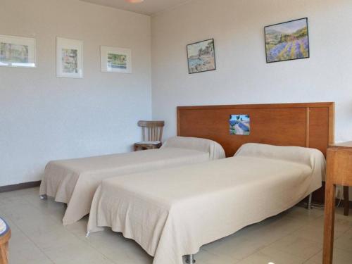 Säng eller sängar i ett rum på Appartement Bormes-les-Mimosas, 2 pièces, 4 personnes - FR-1-251-229