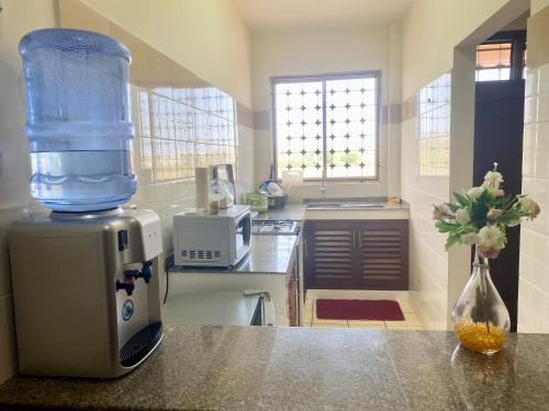 a kitchen with a blender on top of a counter at Dala Heights in Mombasa