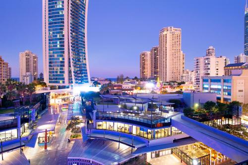 a city skyline with tall buildings at night at Circle on Cavill Surfers Paradise- 3 Bedroom Superior Apartment in Gold Coast