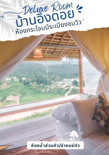 Postel nebo postele na pokoji v ubytování สายหมอกบอกรัก น่าน SAIMOK Bokrak NAN