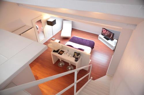 an overhead view of a room with a bed and a table at L'Esplanade Lille in Lille