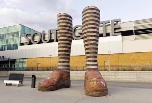 a statue of two large boots in front of a building at Southgate 5 Bedroom Vacation Home with Double Garage in Edmonton