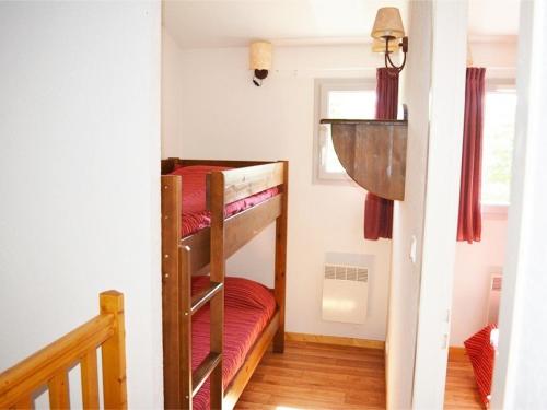 a bedroom with two bunk beds in a room at Maison Duplex 6 Pers. avec Terrasse, Piscine Chauffée, Parking Gratuit - Vallon-Pont-d'Arc - FR-1-382-55 in Vallon-Pont-dʼArc