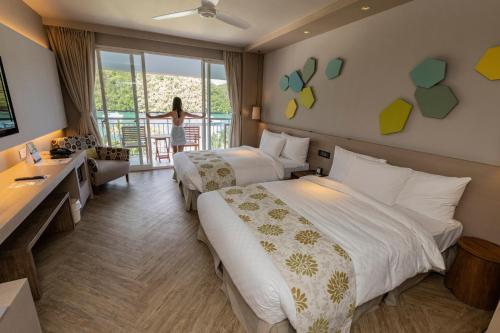 Postel nebo postele na pokoji v ubytování Palau Royal Resort