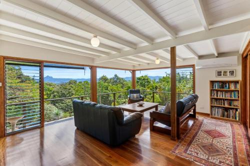 a living room with a view of the mountains at Farrants Hill - Tweed Coast Holidays in Clothiers Creek