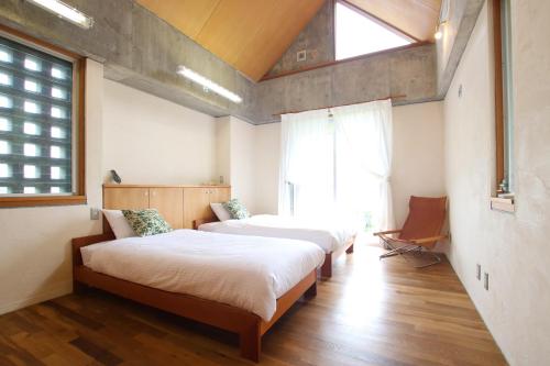 Ένα ή περισσότερα κρεβάτια σε δωμάτιο στο Sea-k-SEVEN Hotels and Resorts-