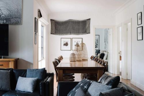 a living room with a table and chairs at Carrington House Daylesford in Daylesford