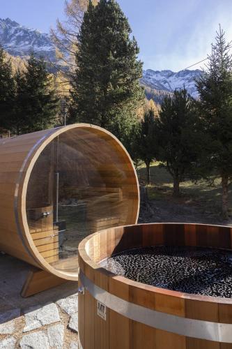a circular building with a large window and a tub at Polaris 1 001 - LUXE & SKI LIFT apartment 6 pers in Zinal