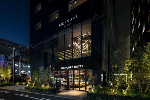 a nighttime view of the welcome hotel at Mercure Tokyu Stay Osaka Namba in Osaka