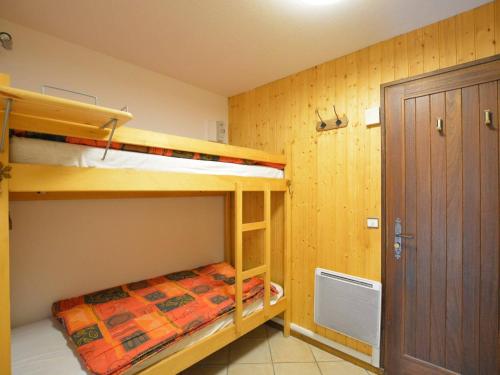 a bedroom with two bunk beds and a closet at Studio Le Grand-Bornand, 1 pièce, 4 personnes - FR-1-241-173 in Le Grand-Bornand