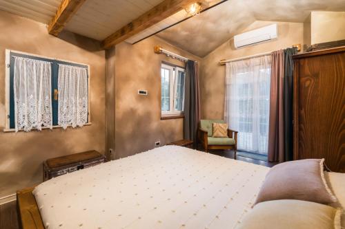 Posteľ alebo postele v izbe v ubytovaní Rustic Cozy house Pupy