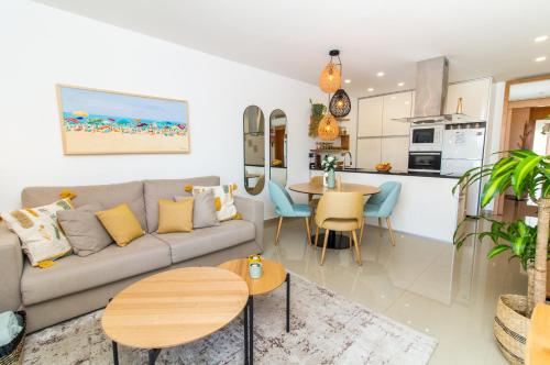 a living room with a couch and a table at By the sea, Algarve in Galé